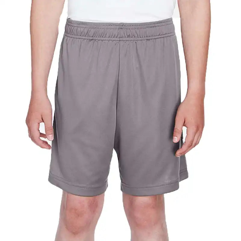 Gray shorts worn by a person on a white background