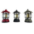 Three hanging lanterns in red, black, and green 